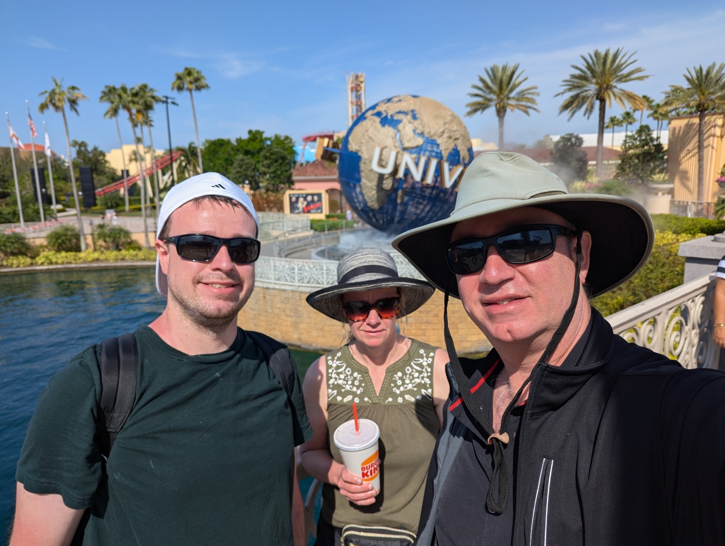 Us in front of the Universal globe
